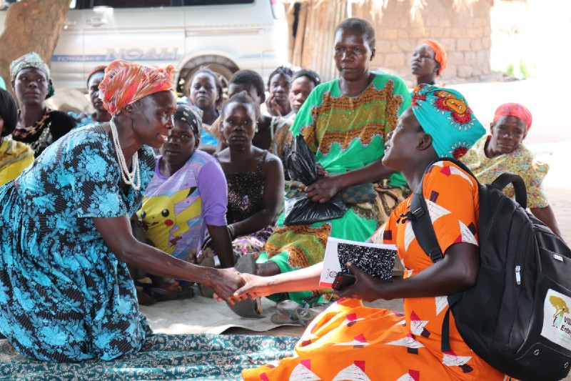 Village Enterprise women during a business savings group meeting.