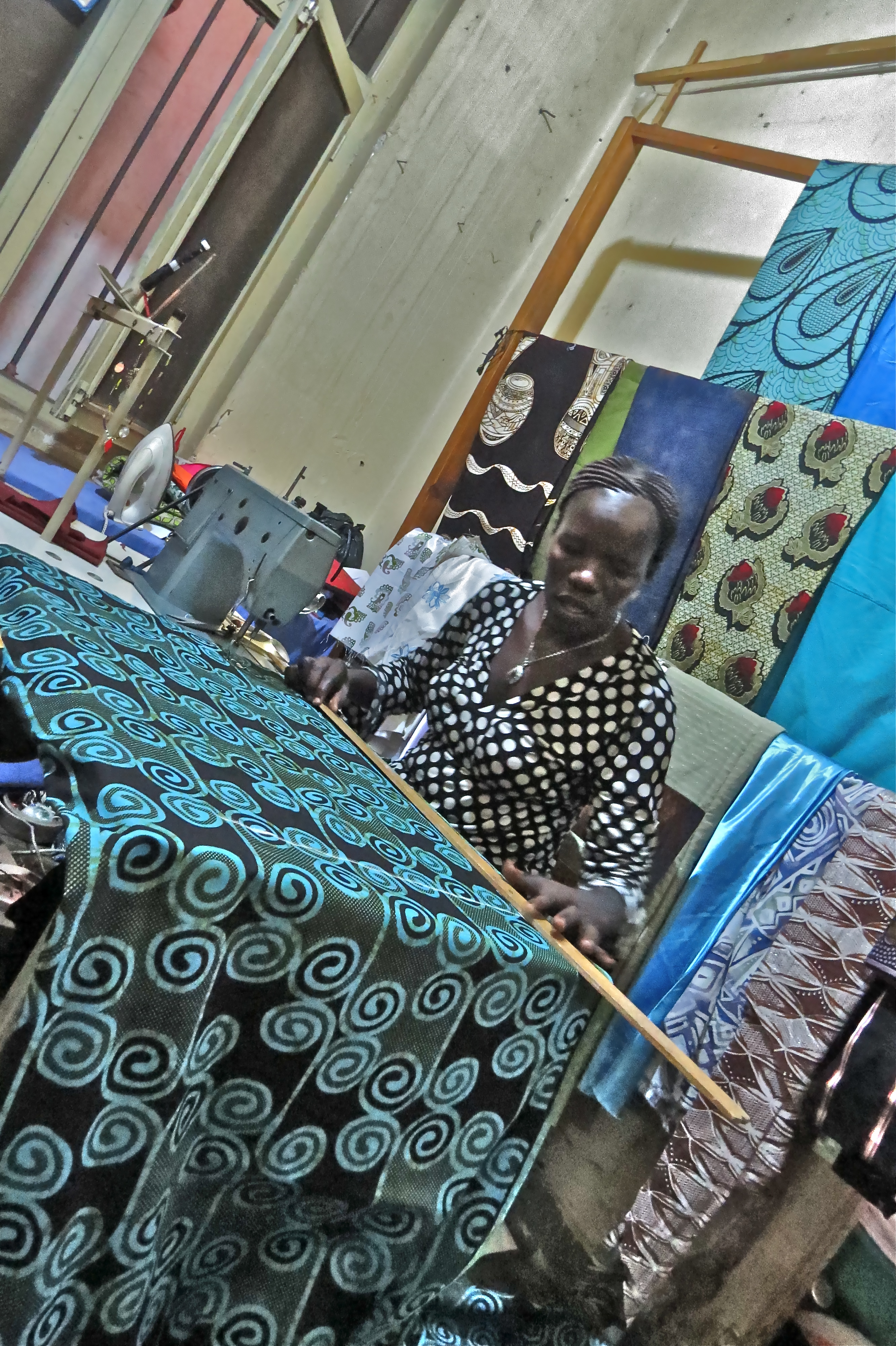 Village Enterprise business owner Hellen sewing