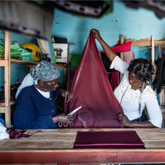 Seamstress cutting cloth